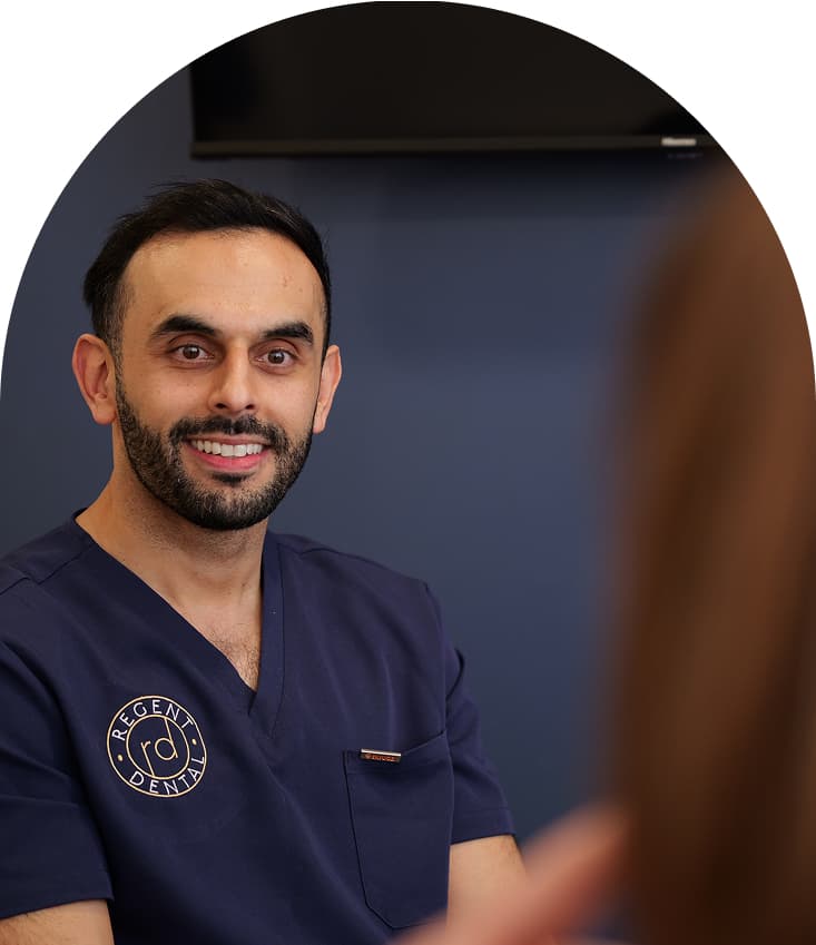 Regent Dental clinician discussing full arch dental implant treatment