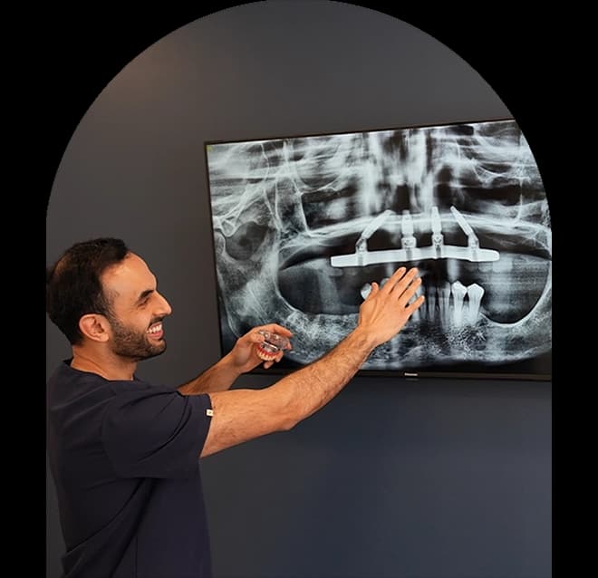 Dr Nadeem Sabir explaining dental implant planning