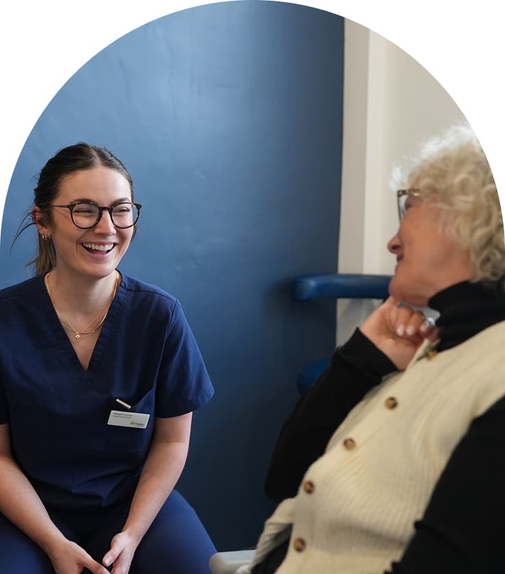 Regent Dental team member speaking with a patient during an appointment