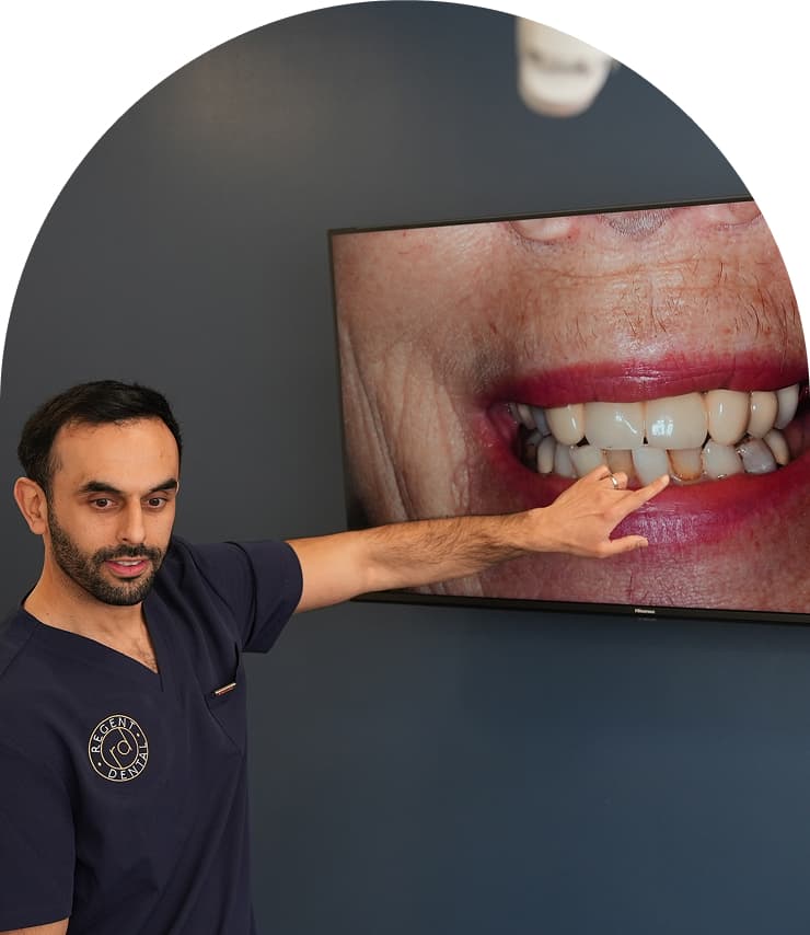 Regent Dental clinician explaining dental implant results on screen