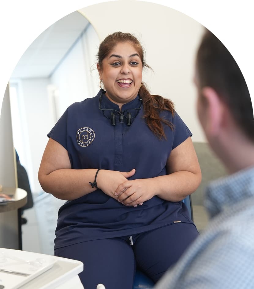 Regent Dental team member discussing root canal aftercare with a patient