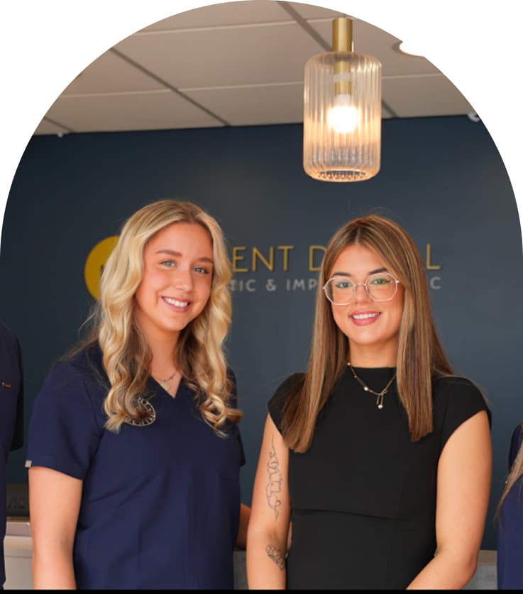 Two members of the Regent Dental team standing inside the clinic
