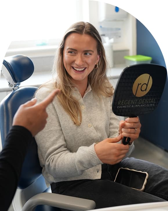 Regent Dental team member speaking with a patient during an appointment