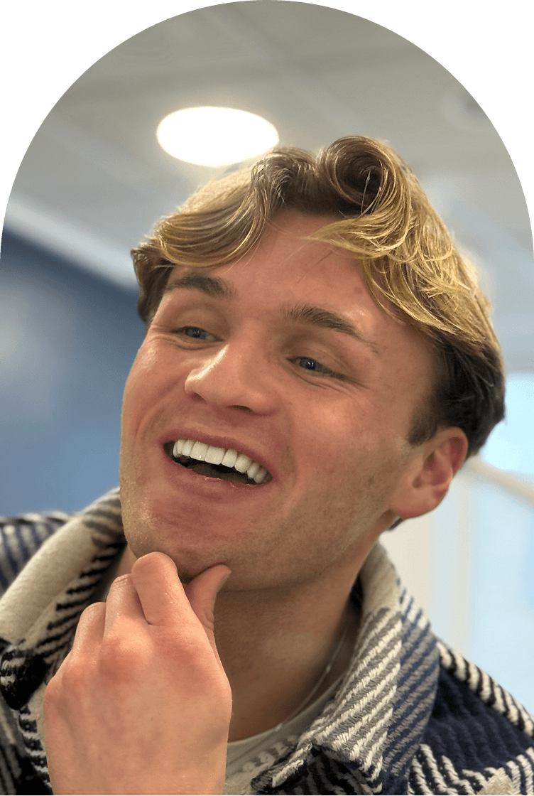Patient laughing and showing his new smile