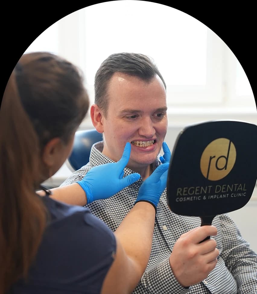 Regent Dental team member discussing root canal aftercare with a patient