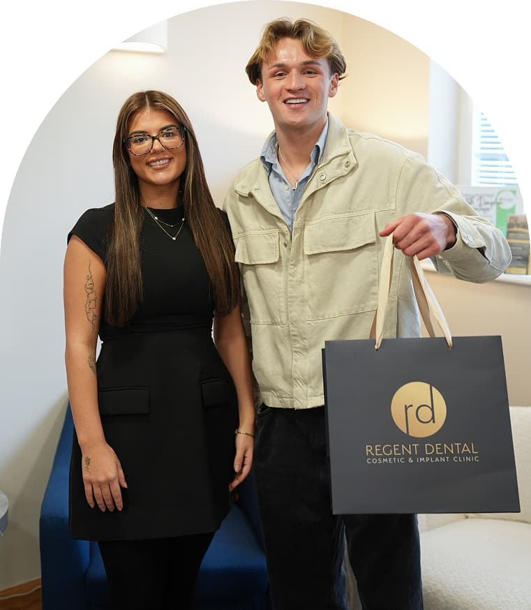 Regent Dental team member standing with a patient after an appointment
