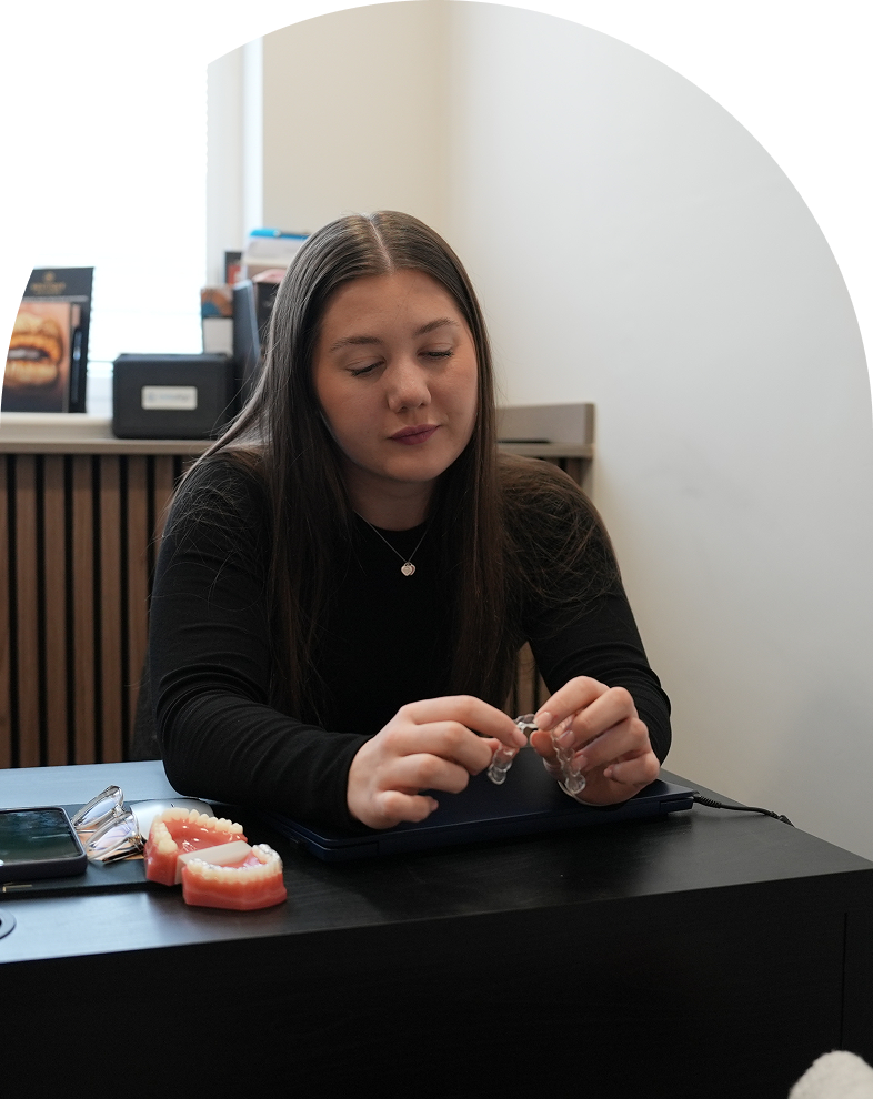 patient at Regent Dental Care holding branded bag